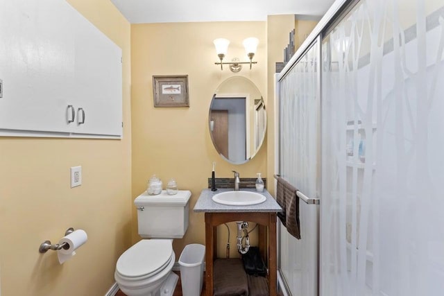 536 E 1st Ave, Colville, WA 99114 - bathroom with toilet, vanity, and curtained shower