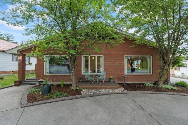 536 E 1st Ave, Colville, WA 99114 - view of front of property with brick siding and covered porch