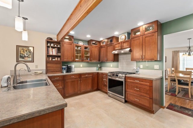 536 E 1st Ave, Colville, WA 99114 - kitchen featuring stainless steel range with gas stovetop, a sink, brown cabinetry, pendant lighting, and recessed lighting