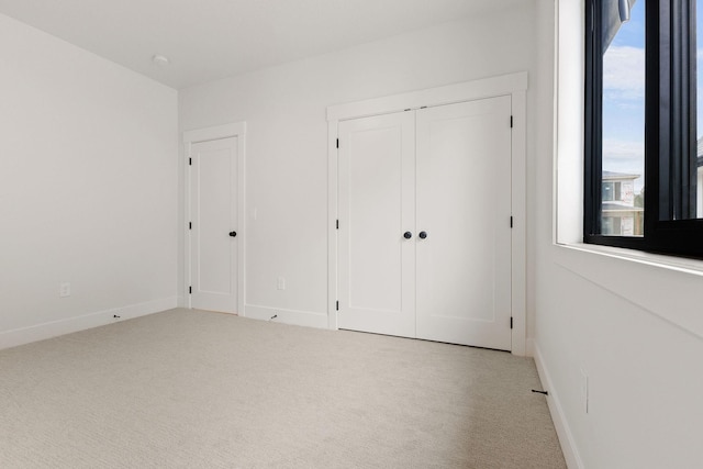 11711 E Honeycomb Springs Ln, Spokane, WA 99206 - unfurnished bedroom featuring carpet, baseboards, and a closet