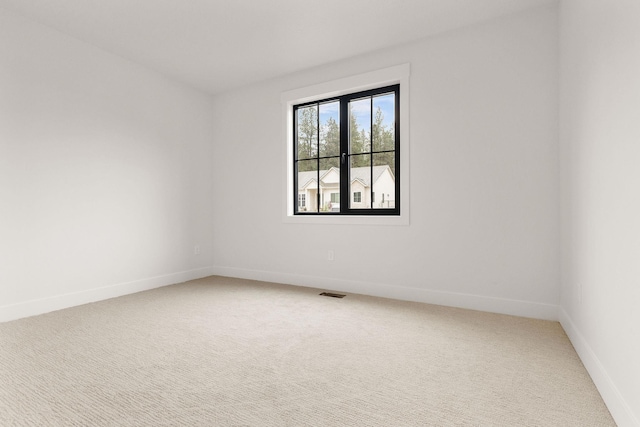 11711 E Honeycomb Springs Ln, Spokane, WA 99206 - empty room featuring light colored carpet and baseboards