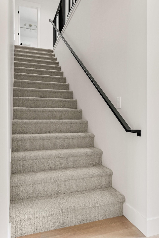 11711 E Honeycomb Springs Ln, Spokane, WA 99206 - stairs with wood finished floors and baseboards
