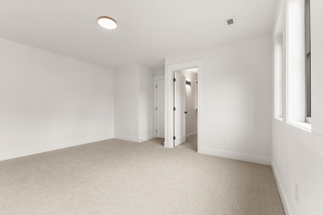 11711 E Honeycomb Springs Ln, Spokane, WA 99206 - spare room featuring light colored carpet and baseboards
