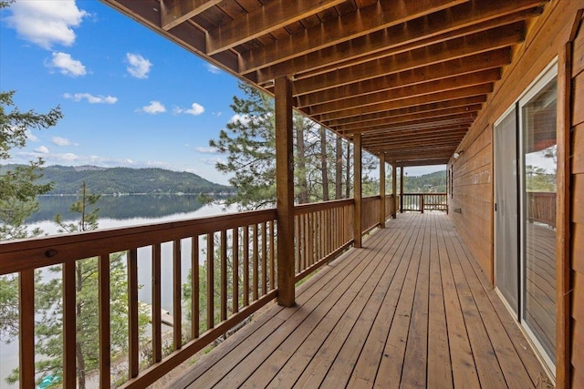 3947 N Deer Lake Rd, Loon Lake, WA 99148 - wooden deck featuring a water view