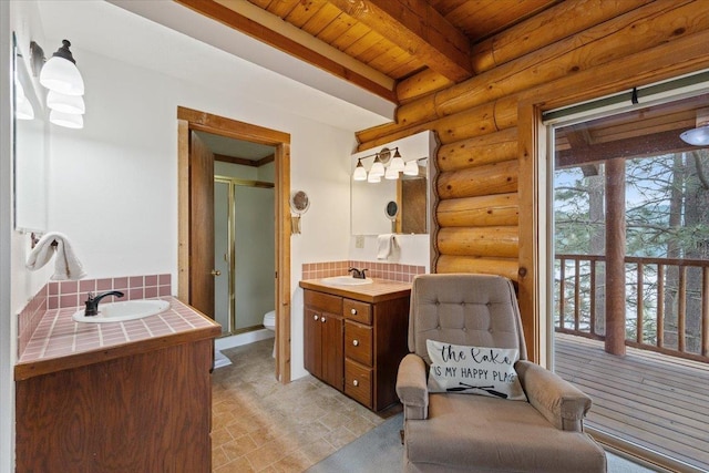 3947 N Deer Lake Rd, Loon Lake, WA 99148 - full bath featuring log walls, wooden ceiling with exposed beams, vanity, a stall shower, and toilet