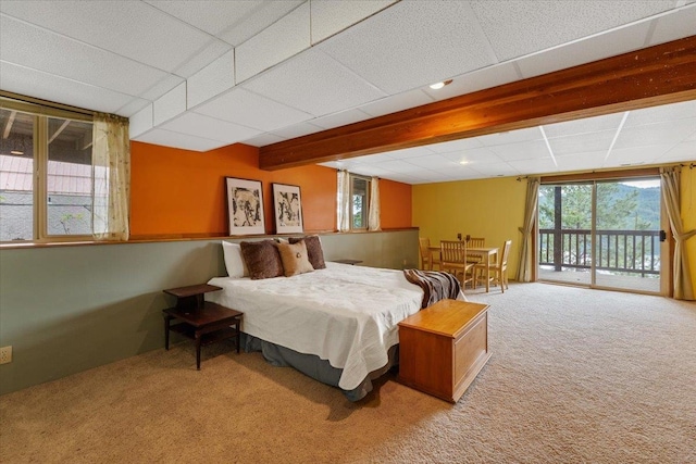 3947 N Deer Lake Rd, Loon Lake, WA 99148 - carpeted bedroom featuring access to exterior and beamed ceiling