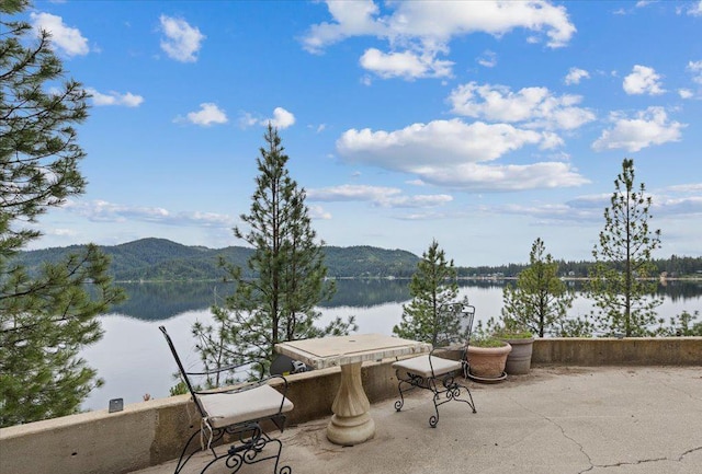 3947 N Deer Lake Rd, Loon Lake, WA 99148 - view of patio featuring a water and mountain view