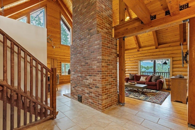 3947 N Deer Lake Rd, Loon Lake, WA 99148 - entrance foyer featuring high vaulted ceiling, wooden ceiling with exposed beams, stairs, and log walls