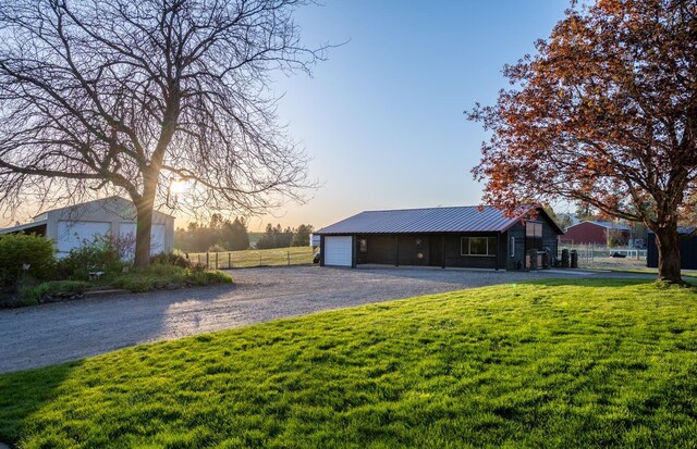 10409 E Palouse Hwy, Valleyford, WA 99036 - single story home with metal roof, driveway, and a garage