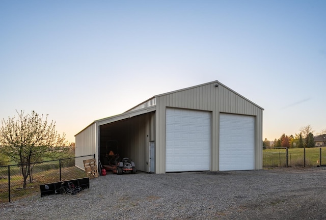 10409 E Palouse Hwy, Valleyford, WA 99036 - garage at dusk featuring a garage