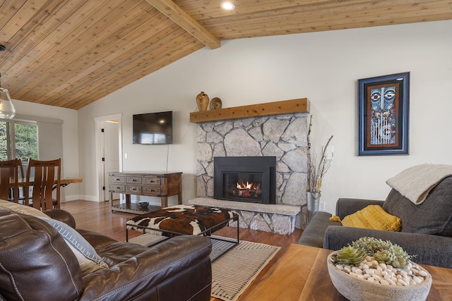 10409 E Palouse Hwy, Valleyford, WA 99036 - living room with a stone fireplace, wood finished floors, baseboards, and wooden ceiling