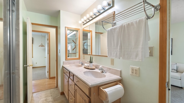13110 W Charles Rd, Nine Mile Falls, WA 99026 - bathroom featuring double vanity and baseboards