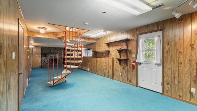 13110 W Charles Rd, Nine Mile Falls, WA 99026 - basement with wood walls, stairs, carpet flooring, and a baseboard radiator