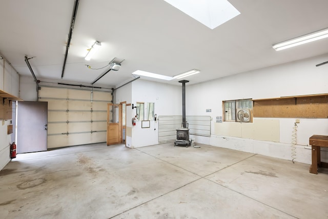 13110 W Charles Rd, Nine Mile Falls, WA 99026 - garage with a garage door opener and a wood stove