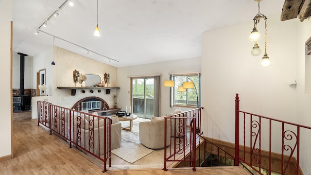 13110 W Charles Rd, Nine Mile Falls, WA 99026 - living room with track lighting, wood finished floors, and a wood stove