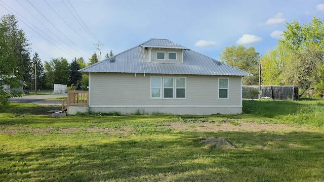 117 5th Ave, Cusick, WA 99119 - view of home's exterior featuring metal roof and a yard