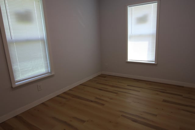 117 5th Ave, Cusick, WA 99119 - spare room featuring light wood-style flooring and baseboards