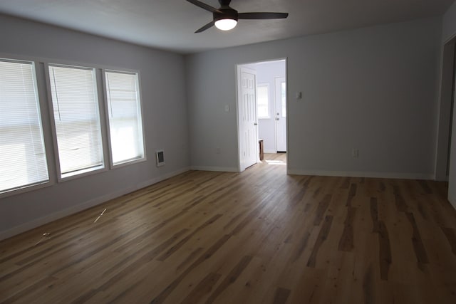 117 5th Ave, Cusick, WA 99119 - unfurnished room with wood finished floors, a ceiling fan, and baseboards
