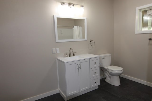 117 5th Ave, Cusick, WA 99119 - bathroom with baseboards, toilet, vanity, and a shower with shower curtain