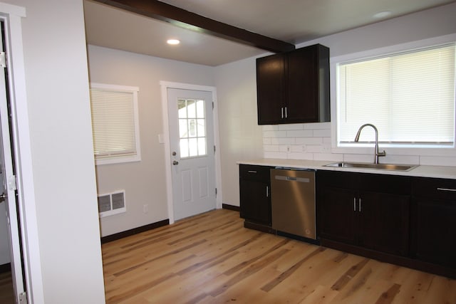 117 5th Ave, Cusick, WA 99119 - kitchen featuring dishwasher, a sink, light wood-type flooring, light countertops, and decorative backsplash