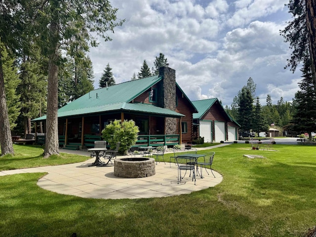 812 Levitch Rd, Newport, WA 99156 - back of house with a fire pit, a patio, a yard, and a chimney