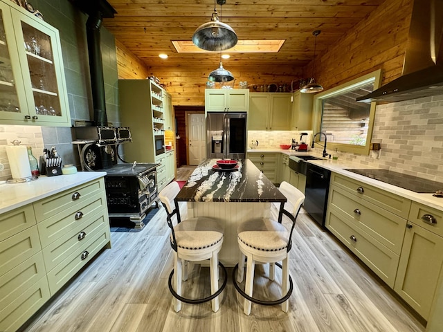 812 Levitch Rd, Newport, WA 99156 - kitchen featuring black appliances, a sink, wall chimney range hood, light wood-style floors, and backsplash