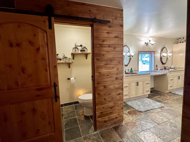 812 Levitch Rd, Newport, WA 99156 - full bath with vanity, stone tile floors, and toilet