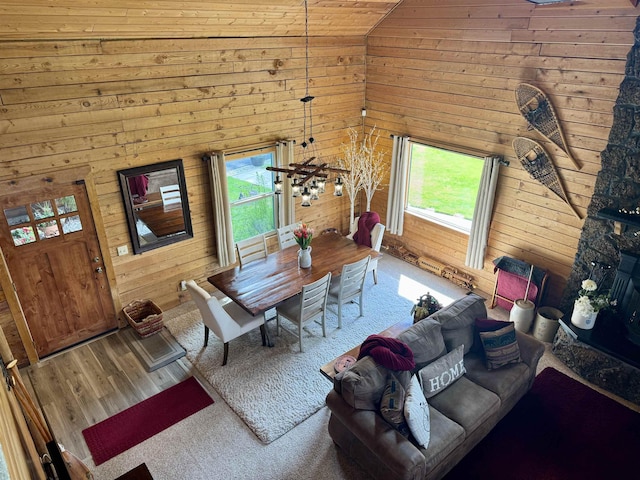 812 Levitch Rd, Newport, WA 99156 - living area with wooden walls, lofted ceiling, and wood finished floors