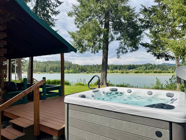 812 Levitch Rd, Newport, WA 99156 - deck with a water view, a forest view, and a hot tub