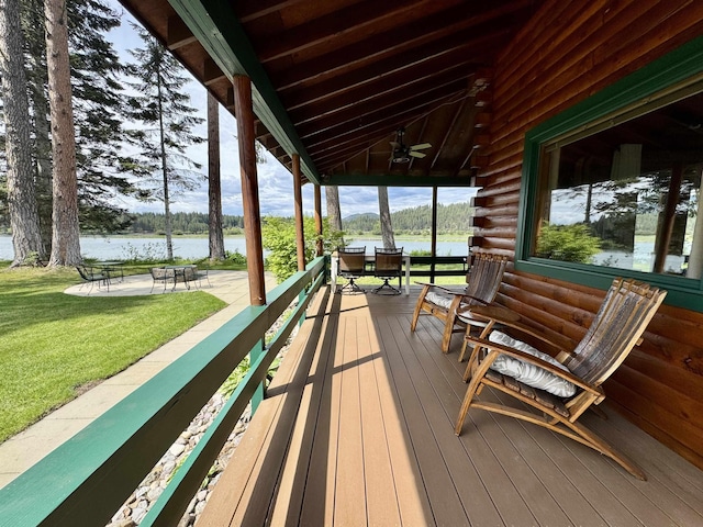 812 Levitch Rd, Newport, WA 99156 - wooden terrace with ceiling fan, a lawn, and a water view