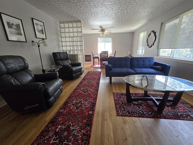 405 S Coeur Dalene St Unit 11, Spokane, WA 99201 - living area with wood finished floors, a textured ceiling, and a ceiling fan
