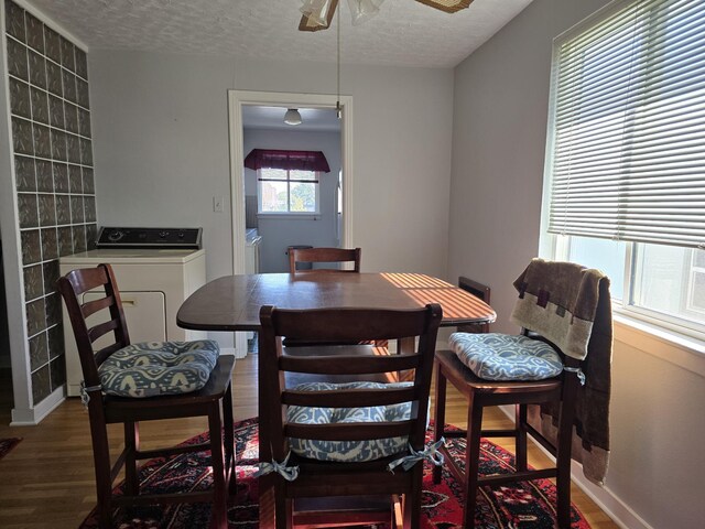 405 S Coeur Dalene St Unit 11, Spokane, WA 99201 - dining area with washer / dryer, ceiling fan, wood finished floors, a textured ceiling, and baseboards