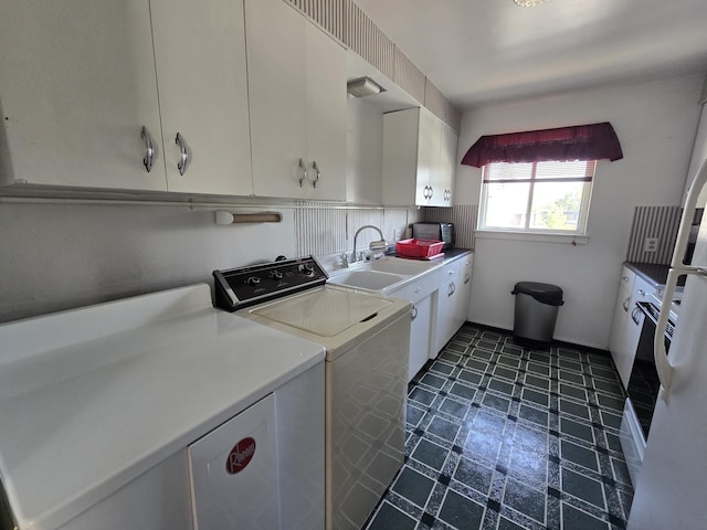 405 S Coeur Dalene St Unit 11, Spokane, WA 99201 - laundry room featuring cabinet space, dark floors, and separate washer and dryer