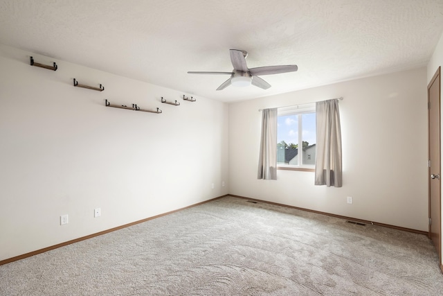 8566 N Oak St, Spokane, WA 99208 - empty room featuring ceiling fan, light colored carpet, and baseboards