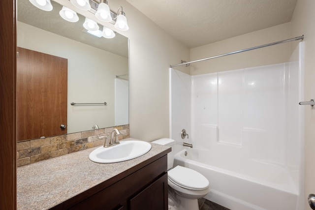 8566 N Oak St, Spokane, WA 99208 - bathroom featuring vanity, toilet, bathtub / shower combination, and a textured ceiling