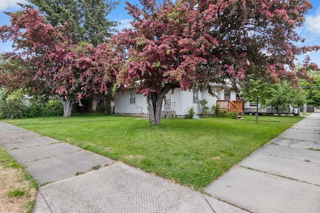 2029 E Sharp Ave, Spokane, WA 99202 - view of home's exterior with a yard