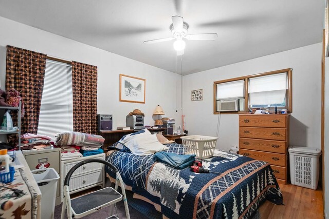 2029 E Sharp Ave, Spokane, WA 99202 - bedroom with wood finished floors, cooling unit, and ceiling fan