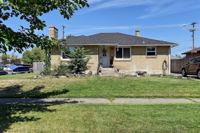 301 E Ermina Ave, Spokane, WA 99207 - view of front of home with a chimney, brick siding, and a shingled roof