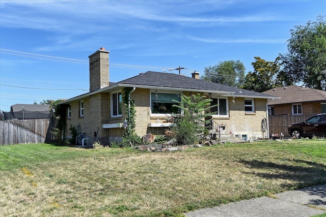 301 E Ermina Ave, Spokane, WA 99207 - back of house with a chimney, brick siding, and cooling unit