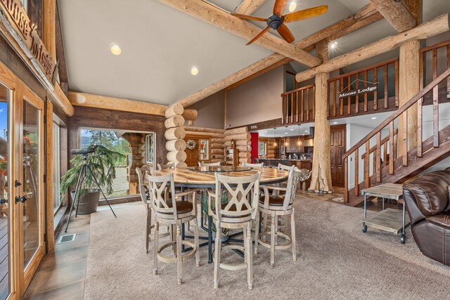 33905 Winterwood Ln Unit E, Davenport, WA 99122 - dining room featuring log walls, high vaulted ceiling, beam ceiling, a ceiling fan, and recessed lighting