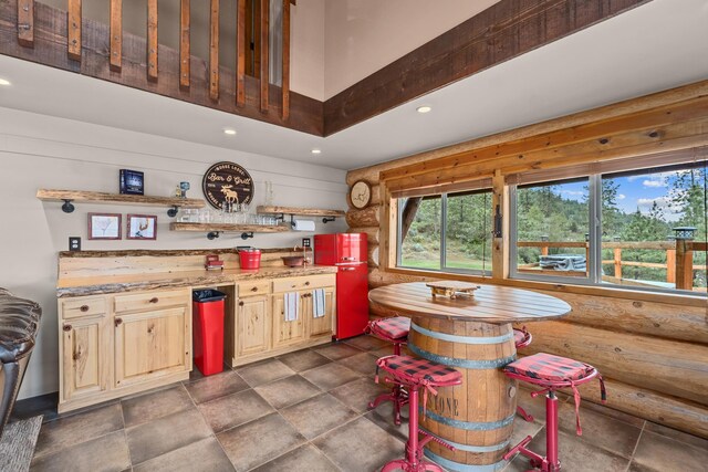 33905 Winterwood Ln Unit E, Davenport, WA 99122 - kitchen featuring recessed lighting, dark stone finish floors, a high ceiling, and light countertops