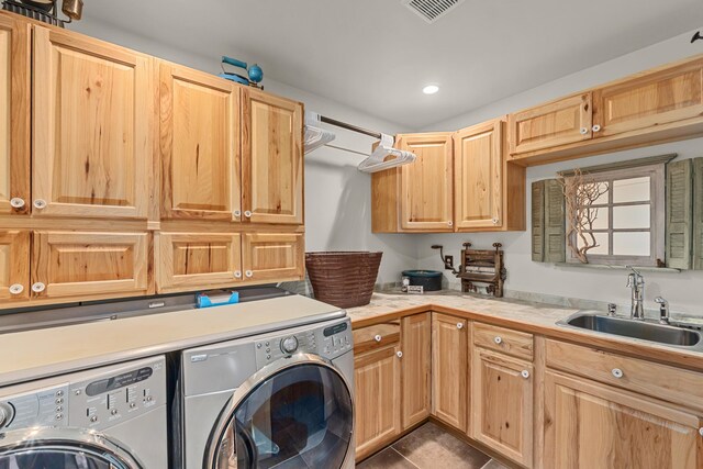 33905 Winterwood Ln Unit E, Davenport, WA 99122 - laundry room featuring washing machine and dryer, cabinet space, dark tile patterned flooring, and recessed lighting