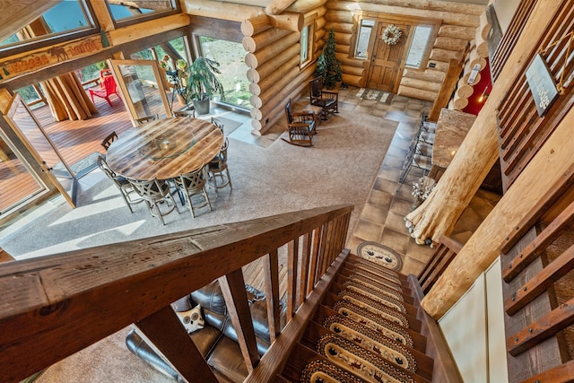 33905 Winterwood Ln Unit E, Davenport, WA 99122 - stairway featuring log walls and healthy amount of natural light