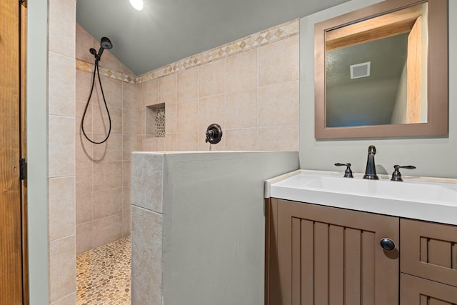 33905 Winterwood Ln Unit E, Davenport, WA 99122 - bathroom featuring a walk in shower, vanity, and vaulted ceiling