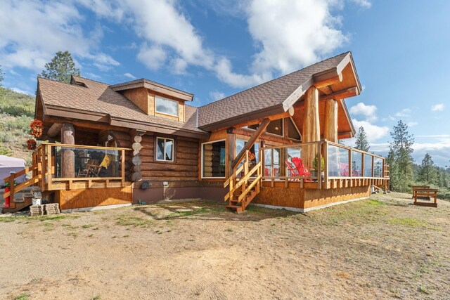 33905 Winterwood Ln Unit E, Davenport, WA 99122 - back of property featuring log siding, a shingled roof, and a wooden deck