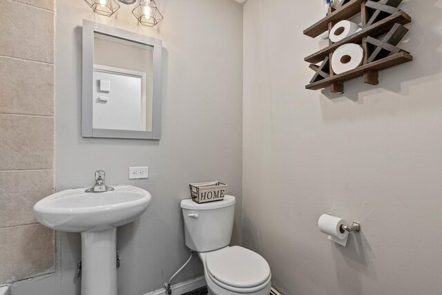 3006 W Francis Ave, Spokane, WA 99205 - half bathroom featuring toilet and a sink