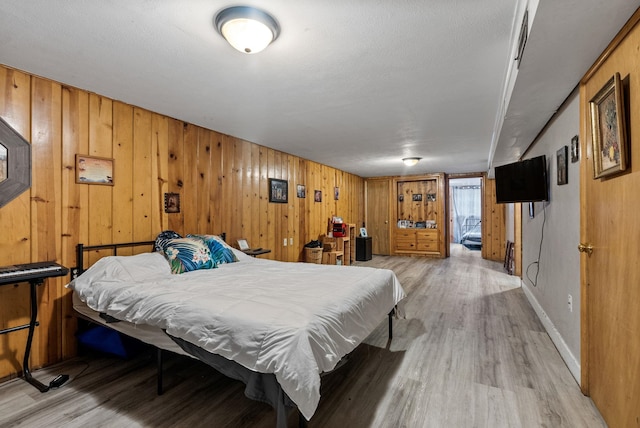 3006 W Francis Ave, Spokane, WA 99205 - bedroom featuring light wood finished floors and wooden walls
