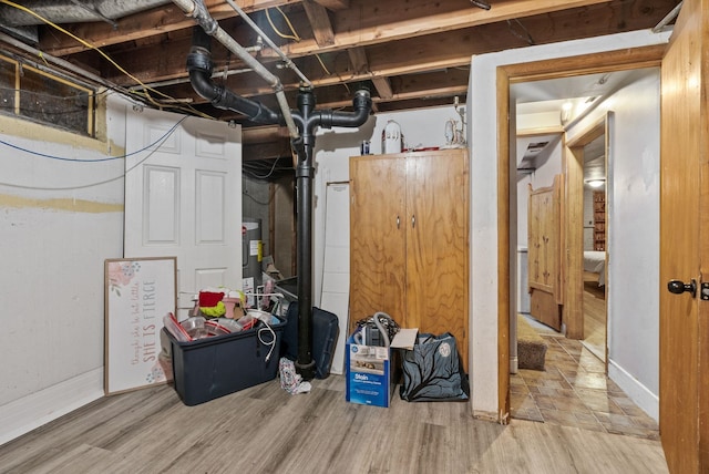 3006 W Francis Ave, Spokane, WA 99205 - basement with wood finished floors, electric water heater, and baseboards
