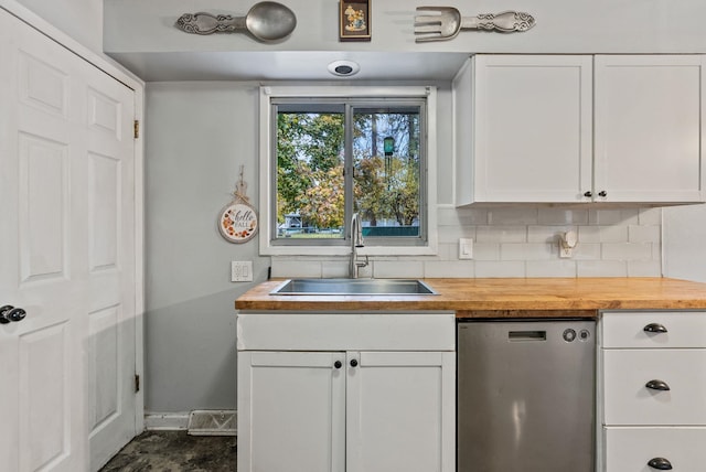3006 W Francis Ave, Spokane, WA 99205 - kitchen with a sink, butcher block countertops, white cabinets, and tasteful backsplash