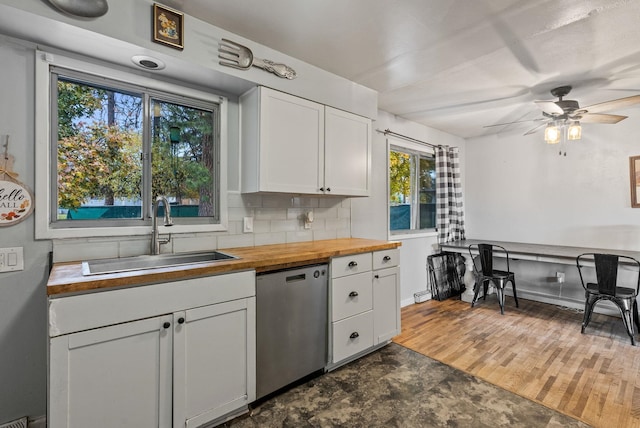 3006 W Francis Ave, Spokane, WA 99205 - kitchen with dishwasher, butcher block counters, a sink, ceiling fan, and white cabinetry